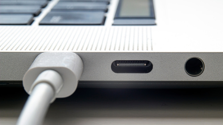 A USB-C cable plugged into a MacBook.